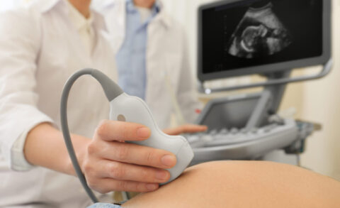 Doctor,Conducting,Ultrasound,Examination,Of,Pregnant,Woman,In,Clinic,,Closeup